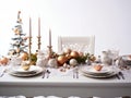 Christmas dinner setting in a light modern dining room. Winter holidays and celebration concept - table served for festive party Royalty Free Stock Photo