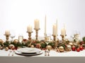 Christmas dinner setting in a light modern dining room. Winter holidays and celebration concept - table served for festive party Royalty Free Stock Photo