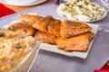 Christmas dinner table with fried salmon fillets and eggs mayonnaise