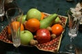 Christmas dinner table with a fruit bowl on a colorful tablecloth Royalty Free Stock Photo