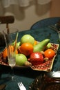 Christmas dinner table with a fruit bowl on a colorful tablecloth Royalty Free Stock Photo