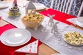 Christmas dinner table with vegetables salad and eggs mayonnaise