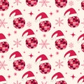 Christmas disco balls seamless pattern with Santa hats, snowflakes and starbursts in red and pink Royalty Free Stock Photo