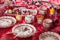 Christmas dishes, cutlery and decor in red and white