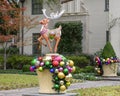 Christmas display with Reindeer atop pedestal adorned with large Christmas bulbs in Dallas, Texas