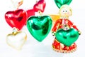 Christmas doll an angel give a Heart on white background
