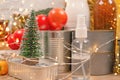 Christmas donations - food and medicines donations with bokeh ligths on background - canned food, sanitizer with Christmas