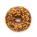 Christmas donut with chocolate icing and golden stars. Royalty Free Stock Photo
