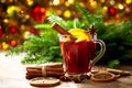 Christmas drink. Glass of hot mulled wine with oranges, anise and cinnamon Royalty Free Stock Photo