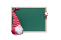 Christmas Elf and Santa Claus Ornament Beside an Empty Green Chalkboard on a White Background Royalty Free Stock Photo
