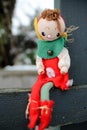Christmas Elf on a Shelf Outdoors Sitting on wood fencing Royalty Free Stock Photo