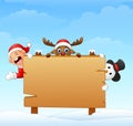 Christmas elf and snowman and reindeer with blank wooden sign Royalty Free Stock Photo