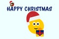 Christmas emoji smiling in hat carrying a gift, Happy Christmas text