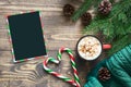 Christmas empty black blank for letter to Santa and cup of coffee on the wooden board. Top view, copy space. Flat lay. Royalty Free Stock Photo