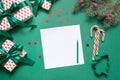Christmas empty blank letter to Santa or invitation on green. Top view Royalty Free Stock Photo