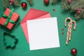 Christmas empty blank letter to Santa or invitation on green. Top view Royalty Free Stock Photo