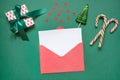 Christmas empty blank letter to Santa or invitation on green. Top view. Royalty Free Stock Photo