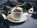 espresso coffee on the table with a garland in the shape of a Christmas tree