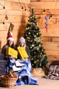 Christmas Eve concept. Girls with happy faces near Christmas tree Royalty Free Stock Photo