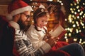 Christmas Eve. family father and child reading magic book at home Royalty Free Stock Photo