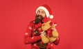 Christmas eve. Gifts for kids. Dear Santa. Bearded man reindeer toy. Plush deer. Hipster man hold Christmas gift. Happy