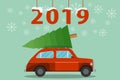 Christmas eve with little classic red car carrying Christmas tree on its rack. Red car and Christmas tree. Car with a christmas