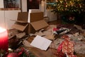 In the Christmas living room there is a chaos of wrapping paper Royalty Free Stock Photo