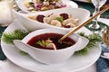 Christmas Eve red borscht with ravioli and beet chips Royalty Free Stock Photo