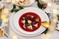 Christmas Eve red borscht with ravioli and beet chips Royalty Free Stock Photo