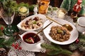 Christmas Eve red borscht with ravioli and beet chips and sauerkraut with mushrooms Royalty Free Stock Photo