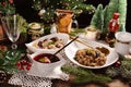 Christmas Eve red borscht with ravioli and beet chips and sauerkraut with mushrooms Royalty Free Stock Photo