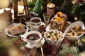 Christmas Eve supper with traditional Polish dishes and pastries on rustic style table Royalty Free Stock Photo