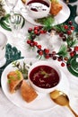 Christmas Eve table with red borscht and croquettes Royalty Free Stock Photo