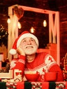 Christmas eve treats. Senior man Santa claus drinking tea. Cocoa recipe. Winter holiday. Cozy interior. Hot beverage and