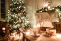 Christmas tree, garlands, candles,lanterns, gifts in the evening. classical interior of a white room with a decorated Royalty Free Stock Photo