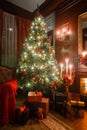 Christmas evening by candlelight. classic apartments with a white fireplace, decorated tree, sofa, large windows and Royalty Free Stock Photo