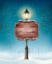 Christmas evening winter landscape with lampposts. Royalty Free Stock Photo