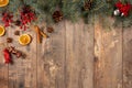 Christmas Evergreen Branches and Berries Over Rustic Wood Horizontal Background. christmas and new year concept Royalty Free Stock Photo
