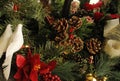 Christmas evergreen branches, two white doves, pine cones, candle, poinsettia Royalty Free Stock Photo