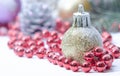 Christmas evergreen spruce tree, glass ball and snow Royalty Free Stock Photo