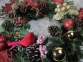 Christmas evergreen wreaths, pine cones, sparkle balls, cardinal Royalty Free Stock Photo