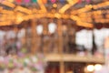 Christmas fair, carousel new year with lights blurred background Royalty Free Stock Photo