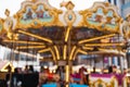 christmas fair, carousel new year with lights blurred background Royalty Free Stock Photo