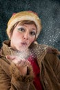 Christmas fairy blowing kiss out of snow and stars Royalty Free Stock Photo