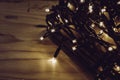 Christmas fairy lights wrapped around card at night Royalty Free Stock Photo