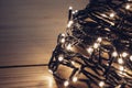 Christmas fairy lights wrapped around card at night Royalty Free Stock Photo