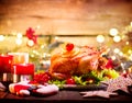 Christmas family dinner. Holiday decorated table with turkey Royalty Free Stock Photo