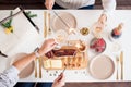 Christmas Family Dinner Table Concept. Christmas feast. Holiday Gold place setting, overhead shoot. Royalty Free Stock Photo