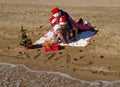 Christmas family at sand beach Royalty Free Stock Photo
