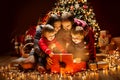 Christmas Family open Lighting Present Gift Box under Xmas Tree, Happy Mother Father Children